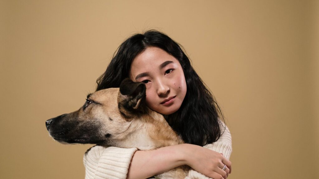 A woman hugging her dog